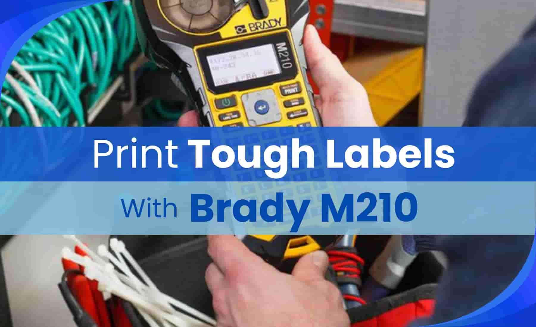 Person using the Brady M210 handheld label maker to organize cables in a professional workspace.
