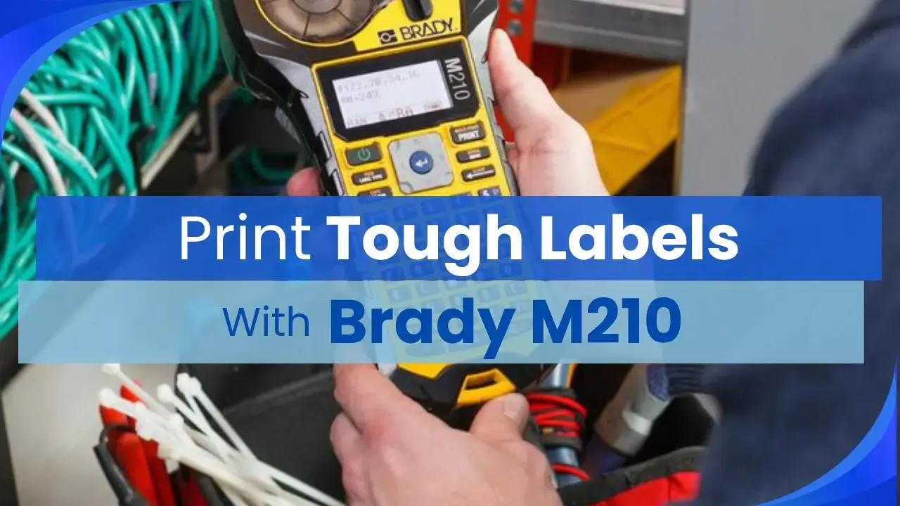 Person using the Brady M210 handheld label maker to organize cables in a professional workspace.